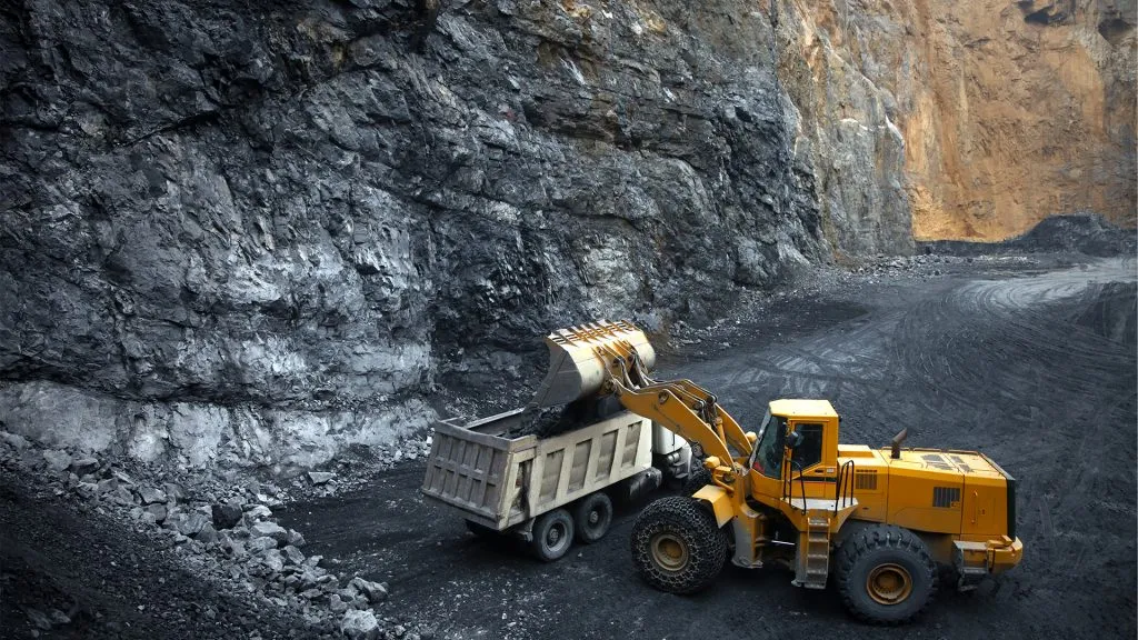 Graphite mine with a yellow truck